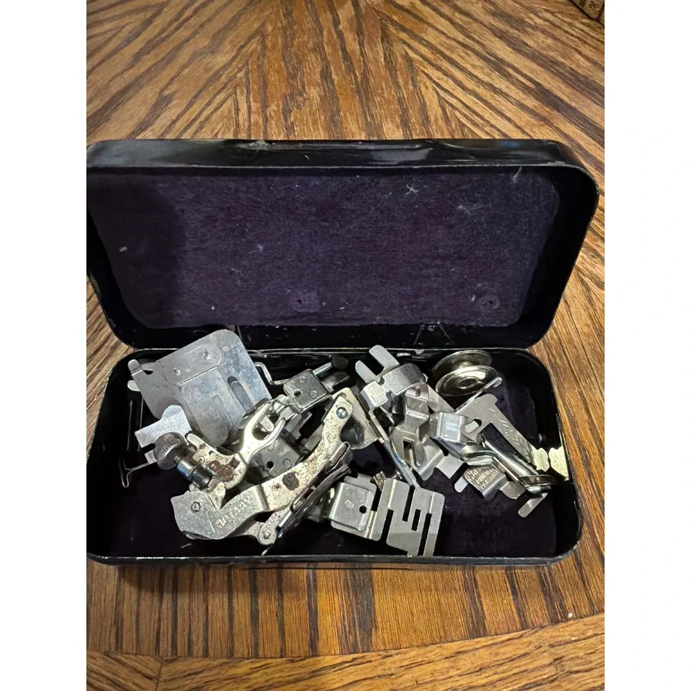 Vintage White Rotary Sewing Machine Attachments Set in Embossed Metal Tin